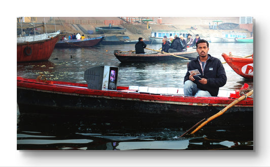 #PRINT - "Man on boat with TV?"